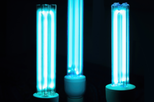 Three blue UV light bulbs showcasing UVC technology for food processing applications.