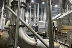 A large industrial pipe featuring EcoMiser technology designed for enhanced energy efficiency and reduced environmental impact.