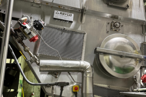 Industrial machine featuring a large metal door, designed for freeze tunnel preparation.